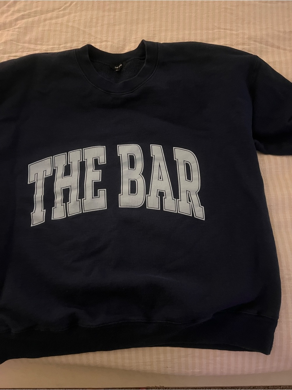 Navy Crewneck Sweatshirt with 'THE BAR'   Light blue writing f on Navy. Size L